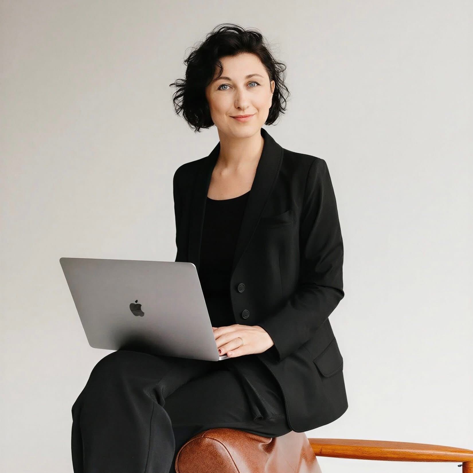 Kate Rybina in conversation at her desk